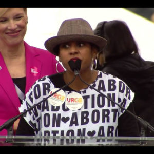 URGE Executive Director Kierra Johnson wears a "(Heart) Abortion" shirt at the 2017 Women's March in D.C.