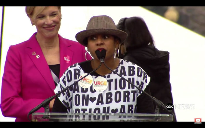  URGE Executive Director Kierra Johnson wears a "(Heart) Abortion" shirt at the 2017 Women's March in D.C.